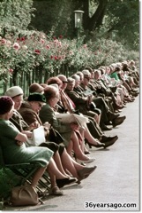 People on benches in park