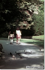 Two girls strolling in park