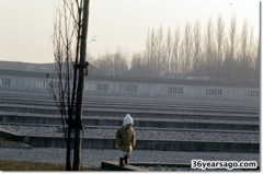 Young child in emptiness of Dachau.